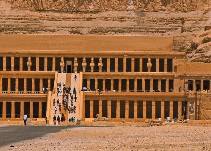 a beautiful view of a number of tourists visiting the temple of hatshepsut in luxor egypt