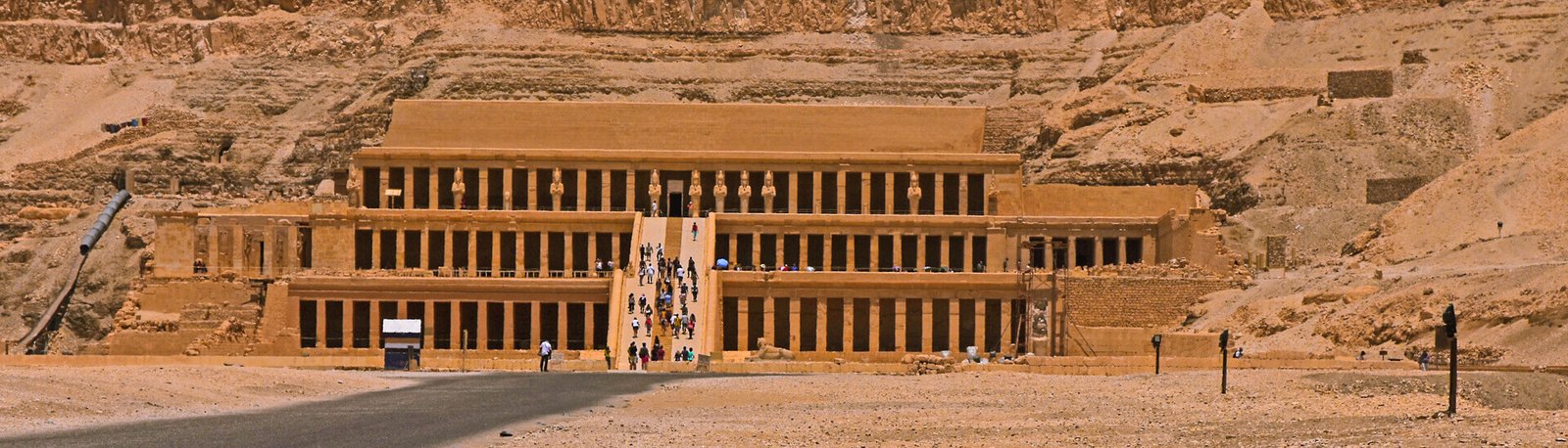 a beautiful view of a number of tourists visiting the temple of hatshepsut in luxor egypt