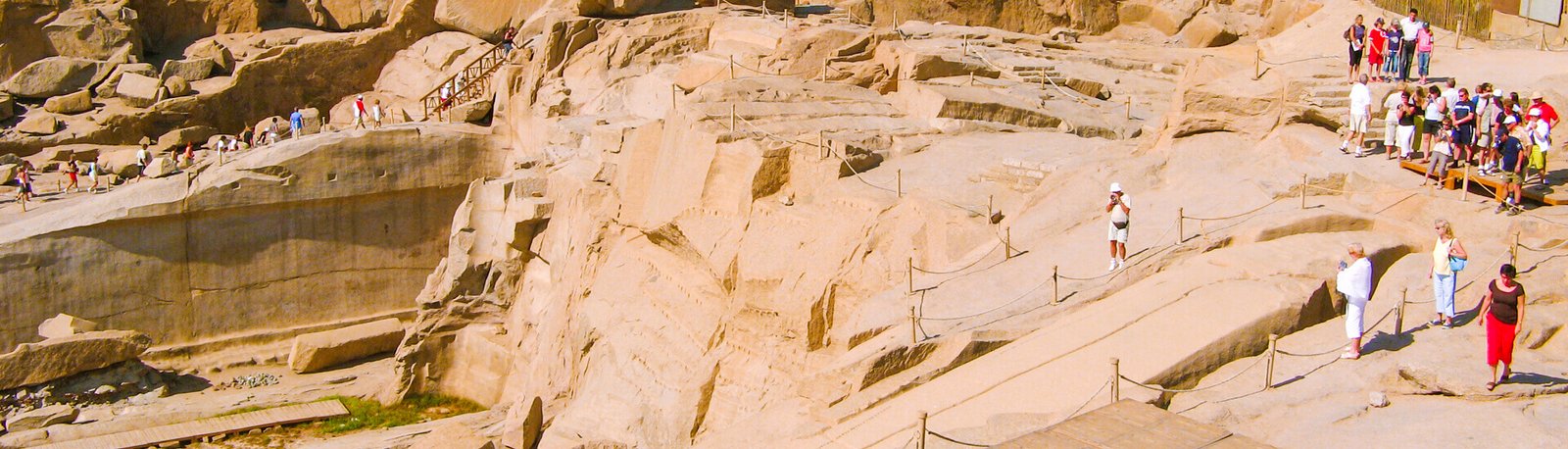 a group of tourists visit the unfinished obelisk in aswan egypt