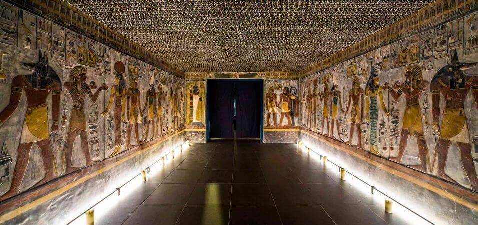 Interior corridor of an Egyptian tomb replica, showcasing ancient art found in the Valley of the Kings