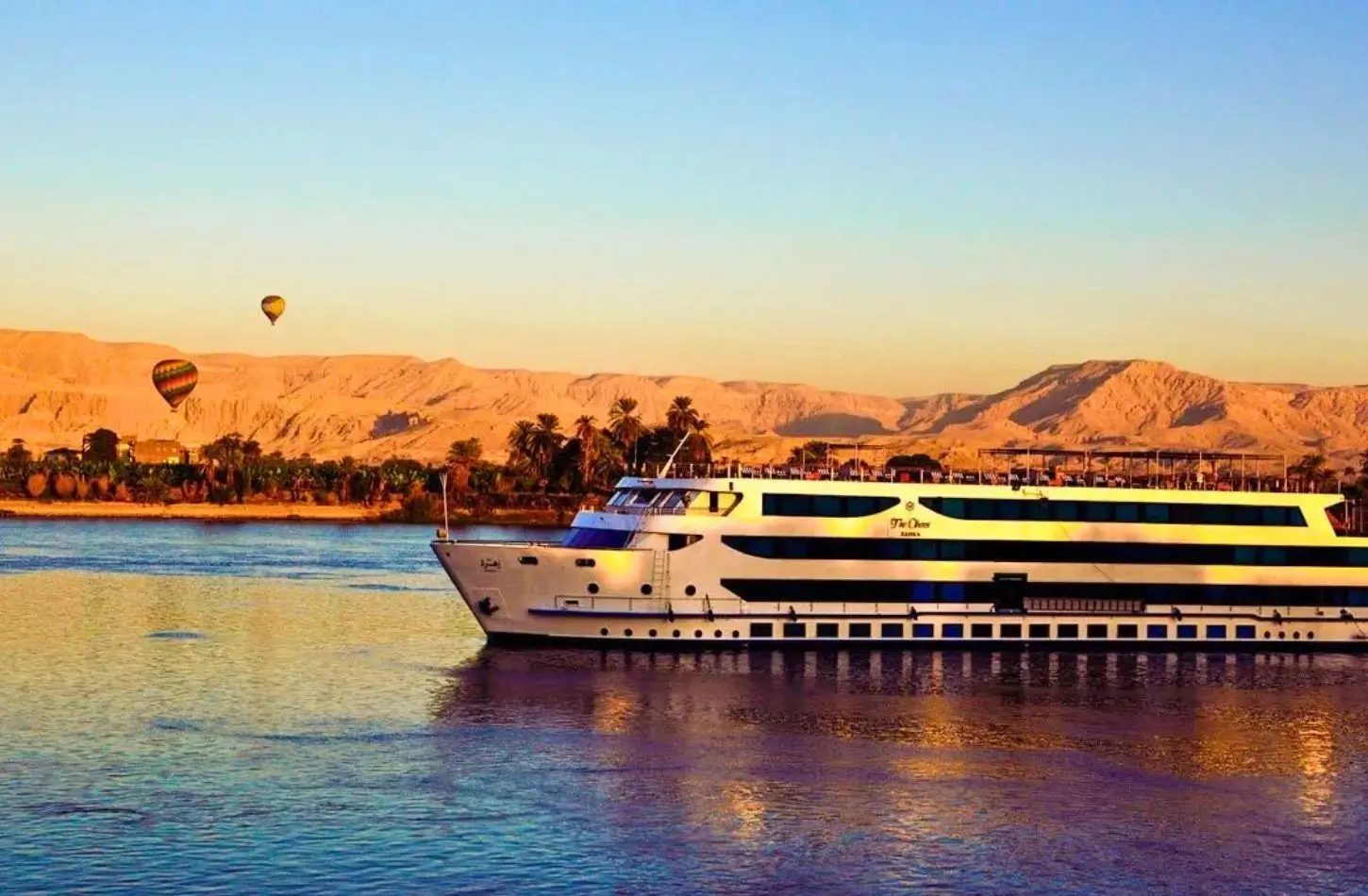 A luxury cabin overlooking the river, showcasing what is included in a Nile cruise accommodation package
