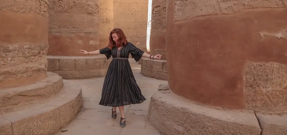 Karnak Temple: A Complete Guide by Yousef Atta 3 A stunning photo of a tourist inside the Karnak Temple