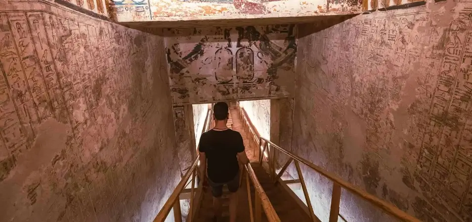 Valley of the Kings, Luxor: Complete History & 2026 Visitor Guide 3 A stunning shot of a tourist descending into the Valley of the Kings