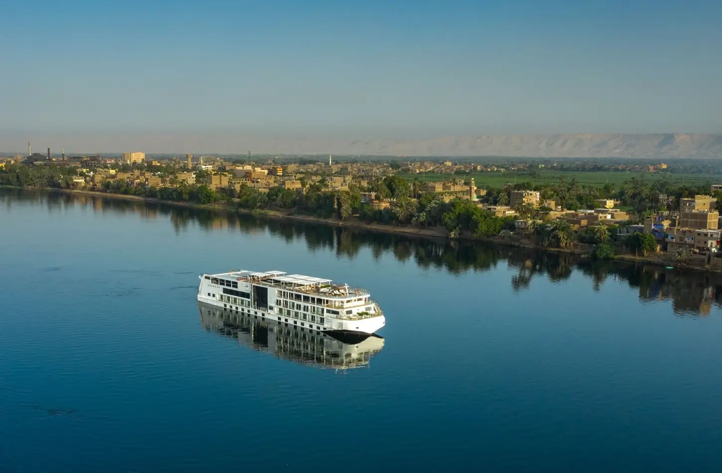 How to Plan a Nile Cruise in Egypt: The Complete Step-by-Step Guide (2026) 1 Aerial view of a luxury cruise ship on the river for a guide on how to plan a Nile cruise in Egypt