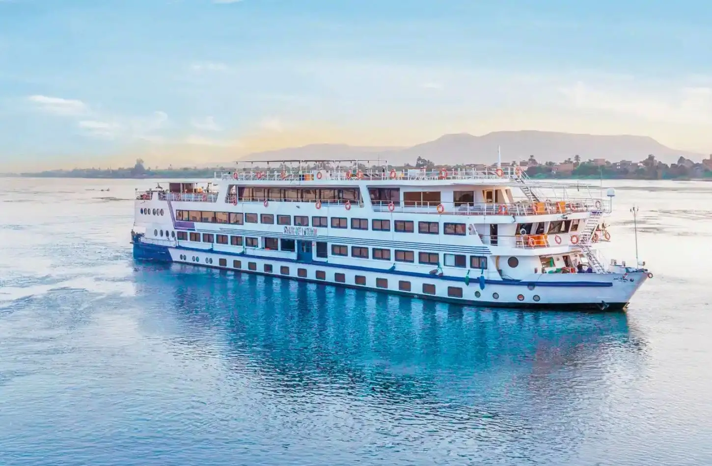 The Star of Luxor luxury riverboat navigates clear waters, representing high-end vessel choices that affect the total Nile Cruise Cost.